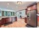 Kitchen featuring stainless steel appliances and an adjoining living room at 1025 Ector Nw Dr, Kennesaw, GA 30152