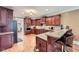 Gourmet kitchen with cherry cabinets, granite countertops and breakfast bar seating at 1025 Ector Nw Dr, Kennesaw, GA 30152