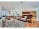 Open-concept living room with hardwood floors, comfortable seating, and seamless flow to the kitchen at 1025 Ector Nw Dr, Kennesaw, GA 30152