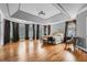 Spacious main bedroom features tray ceilings, hardwood floors, and large windows at 1025 Ector Nw Dr, Kennesaw, GA 30152