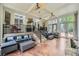 Sunroom with large windows, ceiling fans, and furniture, offering an indoor/outdoor living space at 1025 Ector Nw Dr, Kennesaw, GA 30152