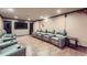 Home theater featuring reclining leather chairs, hardwood floors, and a flat screen television at 1025 Ector Nw Dr, Kennesaw, GA 30152