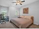 Bright bedroom with soft natural light featuring a ceiling fan and workspace at 2066 Patterson Park Rd, Decatur, GA 30033