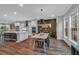 Bright dining area with hardwood floors connecting the kitchen and flooded with natural light at 2066 Patterson Park Rd, Decatur, GA 30033