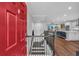 Inviting foyer with hardwood floors, staircase, and an open view into the modern kitchen at 2066 Patterson Park Rd, Decatur, GA 30033
