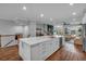Open concept kitchen with a large center island and hardwood floors, flowing into the living area at 2066 Patterson Park Rd, Decatur, GA 30033