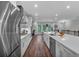 Bright, well-lit kitchen featuring a large island, stainless steel appliances, and a dining area at 2066 Patterson Park Rd, Decatur, GA 30033