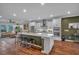 Stylish kitchen with island, stainless steel appliances, and open concept design to living area at 2066 Patterson Park Rd, Decatur, GA 30033