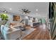 Spacious open-concept living area with hardwood floors and natural light from adjacent kitchen and dining at 2066 Patterson Park Rd, Decatur, GA 30033