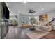 Cozy living room with hardwood floors, neutral furniture, and lots of natural light at 2066 Patterson Park Rd, Decatur, GA 30033