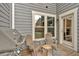Cozy patio space with a grill and chairs, perfect for outdoor dining and entertaining at 2066 Patterson Park Rd, Decatur, GA 30033