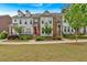 Attractive townhouse showcasing well-maintained lawns, colorful doors, and professionally landscaped gardens at 2066 Patterson Park Rd, Decatur, GA 30033