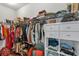 Walk-in closet with built-in shelving, hanging rods, and ample storage space for organization at 2066 Patterson Park Rd, Decatur, GA 30033