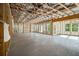 Unfinished basement with exposed beams, insulation, and multiple windows, ready to be transformed into a personalized space at 4039 Tallow Pl, Woodstock, GA 30188
