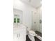 Bathroom featuring a white vanity, walk-in shower with glass doors and black fixtures at 4039 Tallow Pl, Woodstock, GA 30188