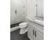Modern bathroom featuring walk-in shower, granite countertops, and a sleek, white vanity at 4039 Tallow Pl, Woodstock, GA 30188