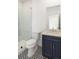 Bathroom featuring a dark blue vanity with marble countertops and patterned tile flooring at 4039 Tallow Pl, Woodstock, GA 30188