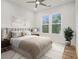 Cozy bedroom features a ceiling fan, two windows and neutral decor at 4039 Tallow Pl, Woodstock, GA 30188