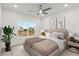 Inviting bedroom with a ceiling fan, natural light, and cozy decor at 4039 Tallow Pl, Woodstock, GA 30188