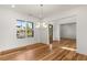 Inviting dining room featuring a stylish chandelier and hardwood floors, perfect for entertaining at 4039 Tallow Pl, Woodstock, GA 30188