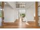 Bright foyer featuring hardwood floors and a soaring two-story ceiling, creating a grand entrance at 4039 Tallow Pl, Woodstock, GA 30188