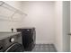 Well-organized laundry room with modern washer and dryer machines at 4039 Tallow Pl, Woodstock, GA 30188
