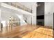 Bright living room with hardwood floors, high ceilings, and fireplace at 4039 Tallow Pl, Woodstock, GA 30188