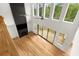 Bright living room with a modern fireplace, large windows, and a sliding glass door to the deck at 4039 Tallow Pl, Woodstock, GA 30188
