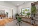 Bright office space with hardwood floors, a modern desk, and a large window offering natural light at 4039 Tallow Pl, Woodstock, GA 30188