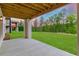 Covered patio with view of fenced backyard at 4039 Tallow Pl, Woodstock, GA 30188