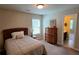 This carpeted bedroom offers a relaxing space and room for storage at 7165 Winthrop Rd, Alpharetta, GA 30005