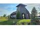 Halcyon's community clubhouse with modern architecture, lush landscaping, and bicycle rack at 7165 Winthrop Rd, Alpharetta, GA 30005