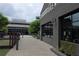 Sidewalk view of retail shops and breweries in Halcyon, including Cherry Street Brewpub, with outdoor seating at 7165 Winthrop Rd, Alpharetta, GA 30005
