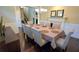 Formal dining room with seating for eight, a fireplace, and elegant decor at 7165 Winthrop Rd, Alpharetta, GA 30005