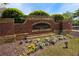 A brick community entrance adorned with colorful flower beds enhances curb appeal and welcomes residents at 7165 Winthrop Rd, Alpharetta, GA 30005