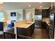 Stylish kitchen featuring granite countertops, stainless steel appliances, and a seamless view to the living room at 7165 Winthrop Rd, Alpharetta, GA 30005