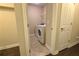 Compact laundry room equipped with a modern washer and dryer at 7165 Winthrop Rd, Alpharetta, GA 30005
