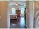 Main bedroom featuring a trey ceiling, hardwood floors, and natural light from windows at 7165 Winthrop Rd, Alpharetta, GA 30005