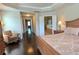 Relax in this spacious main bedroom with access to ensuite bathroom complete with a soaking tub and walk-in shower at 7165 Winthrop Rd, Alpharetta, GA 30005