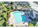 Aerial view of community pool and clubhouse surrounded by lush landscaping in a neighborhood setting at 7165 Winthrop Rd, Alpharetta, GA 30005