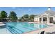 This community pool offers a serene spot for residents, complete with lounge chairs and a charming clubhouse at 7165 Winthrop Rd, Alpharetta, GA 30005