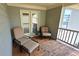 Cozy porch space perfect for relaxing with comfortable seating at 7165 Winthrop Rd, Alpharetta, GA 30005