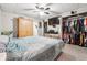 Bedroom with carpet, TV, ceiling fan, closet and an armoire at 1366 Maple Ridge Dr, Suwanee, GA 30024