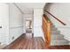 Inviting foyer with hardwood floors, staircase and neutral decor offering a bright and airy entrance at 1366 Maple Ridge Dr, Suwanee, GA 30024