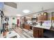 Eat-in kitchen with stainless steel appliances, dark cabinetry, and white countertops at 1366 Maple Ridge Dr, Suwanee, GA 30024