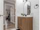 Bright bathroom featuring shiplap accent, modern vanity, and stylish fixtures at 1871 Weems Rd, Locust Grove, GA 30248