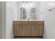 Stylish bathroom featuring double vanities, modern lighting, and elegant fixtures at 1871 Weems Rd, Locust Grove, GA 30248