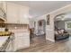 Open-concept kitchen leading to the dining and living areas for easy entertaining at 1871 Weems Rd, Locust Grove, GA 30248