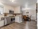 Spacious kitchen with stainless steel appliances and a view of the dining area at 1871 Weems Rd, Locust Grove, GA 30248