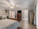 Comfortable main bedroom with a walk-in closet, en suite bathroom, and private balcony at 1871 Weems Rd, Locust Grove, GA 30248